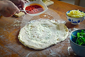 Preparing the Italian pizza