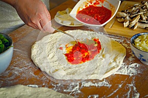 Preparing the Italian pizza