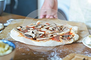 Preparing the Italian pizza