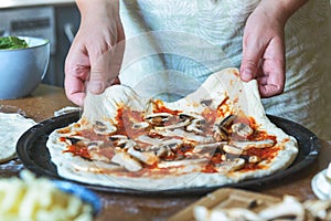 Preparing the Italian pizza