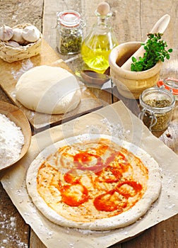 Preparing an Italian pizza