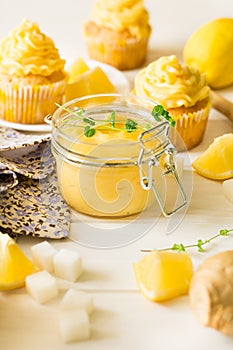 Preparing lemon cupcakes with citrus curd