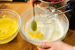 Preparing lemon curd cheesecake batter