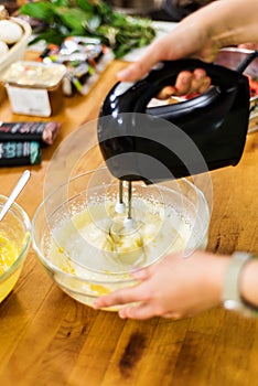 Preparing lemon curd cheesecake batter