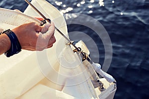 Preparing before lifting staysail sails.