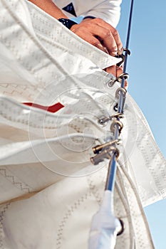 Preparing before lifting staysail sails.