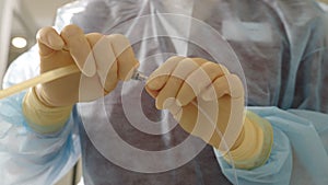 Preparing for medical operation. Close-up view of medical nurse connecting medicine dropper. operating room being