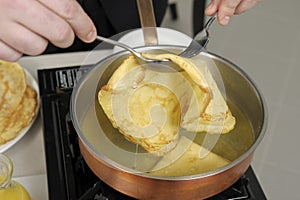 Preparing pancakes flamb