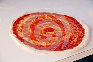 Preparing pizza with Marinara