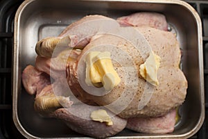 Preparing a raw chicken for roasting