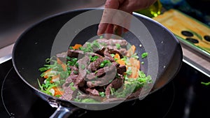 Preparing recipe sesame beef wok, minced summer vegetables