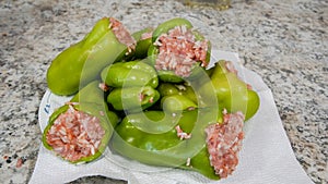 Preparing Stuffed Peppers With Ground Meat on a Kitchen Counter