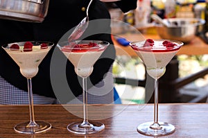 Preparing a sweet rapsberry cocktail