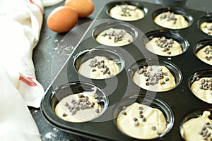 Preparing tasty chocolate muffins at home