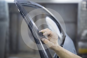 Preparing to paint the car door. Car body repair after an accident