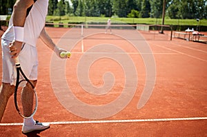 Preparing to serve tennis ball