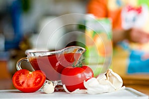Preparing tomato poignant sauce photo