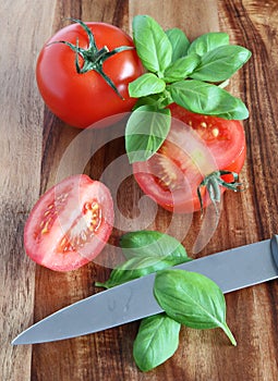 Preparing tomatoes and basil