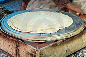 Preparing traditional bread on street market in Shiraz. Iran