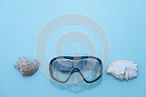 Preparing for vacation, travel or journey. Travel planning. Blue swimming mask on blue background. Minimalism vacation
