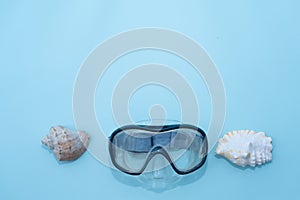 Preparing for vacation, travel or journey. Travel planning. Blue swimming mask on blue background. Minimalism vacation