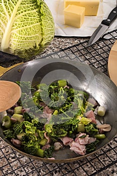 preparing a very irish dish colcannon with savoy cabbage and bacon