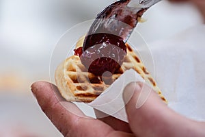 Preparing waffle or waffles with jam, dish made from leavened butter or dough