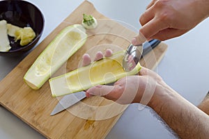 Preparing zuchini hands on the kitchen table