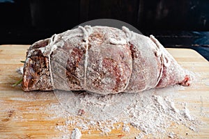 Prepped Stuffed Flank Roulade Steak Dusted in Flour photo