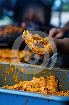 Prepping the chicken skew Kebab barbeque with marinated spices. Traditional Indian and Pakistan dish