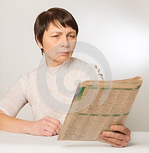 Presbyopia. Woman reading photo