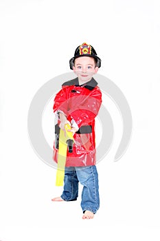 Preschool age boy in fireman costume