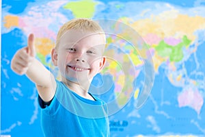 Preschool boy with world map