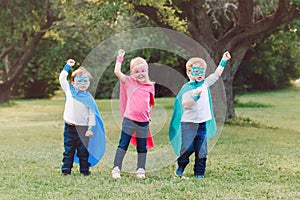 Preschool Caucasian children playing superheroes