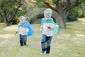 Preschool Caucasian children playing superheroes