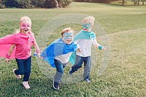 Preschool Caucasian children playing superheroes