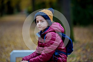 Preschool child, boy, sneezing in park, flu season photo
