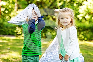 Preschool children play in the park. 2-3 years. Girl and boy. Th