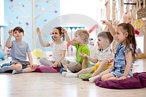 Preschool children on speech therapy lesson in kindergarten photo