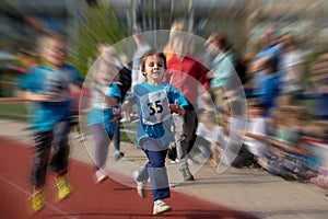 Preschool children run on the marathon road