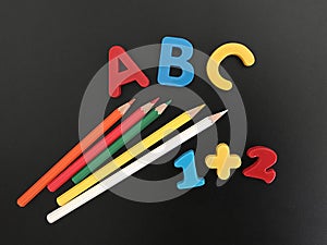 Preschool Education, Colourful Letters, Pencils and Numbers on a Blackboard