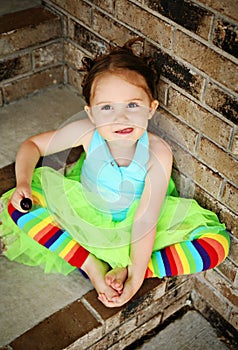 Preschool girl with tutu and candy sucker