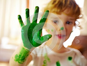 Preschool, hand and paint for boy, color and creativity, growth and development of child with mess. Childcare, learning