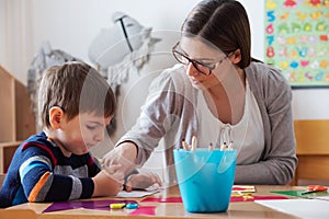 Preschool teacher with child at Kindergarten - Creative Art Class