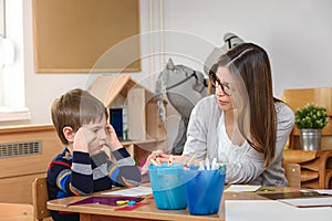 Preschool teacher with child at Kindergarten - Creative Art Class