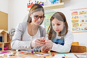 Preschool teacher with child at Kindergarten - Creative Art Class