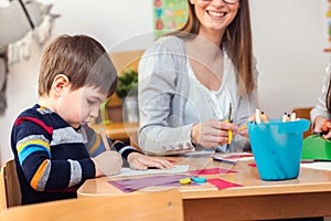 Preschool Teacher with Children at Kindergarten - Creative Art Class