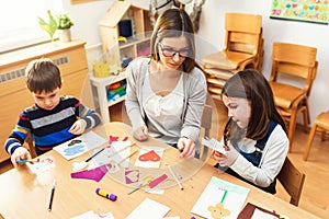 Preschool Teacher with Children at Kindergarten - Creative Art Class