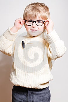 Preschooler blond boy in spectacles or glasses