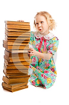 Preschooler with books stack